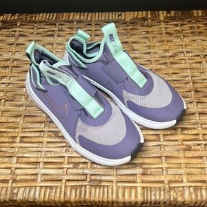 Girls Nike slip-on sneakers. Size 2. Gently used condition.